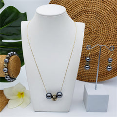 Set Of Bracelet, Earrings And Necklace With Pearls In Different Colors And Gold-Black Hollow Balls