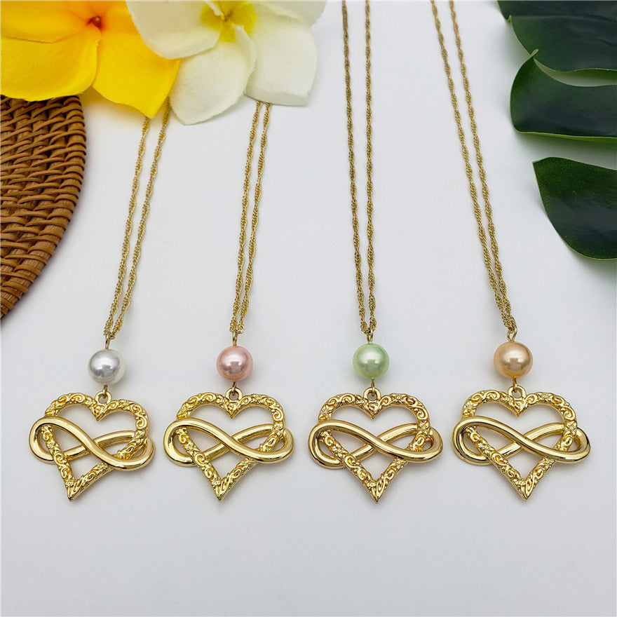 Set Of Infinity Carved Heart Earrings And Necklace Sustained With A Pearl In Different Colors