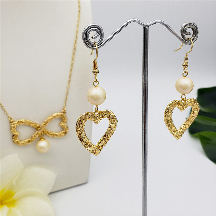 Set Of Carved Heart Earrings And Carved Heart Infinity Necklace Sustained With A Pearl In Different Colors