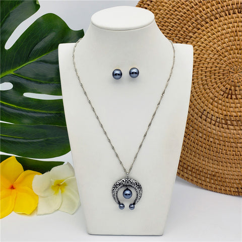 Set Of Petrol Pearl Stud Earrings And Carved Horseshoe Necklace In Silver/Gold With Petrol Pearl
