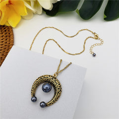 Set Of Petrol Pearl Stud Earrings And Carved Horseshoe Necklace In Silver/Gold With Petrol Pearl