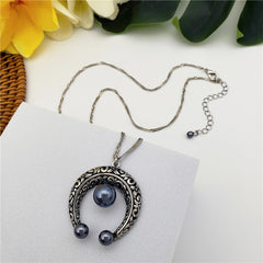 Set Of Petrol Pearl Stud Earrings And Carved Horseshoe Necklace In Silver/Gold With Petrol Pearl