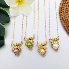 Set Of Pearl Stud Earrings And Octopus Necklace Holding A Pearl In Different Colors