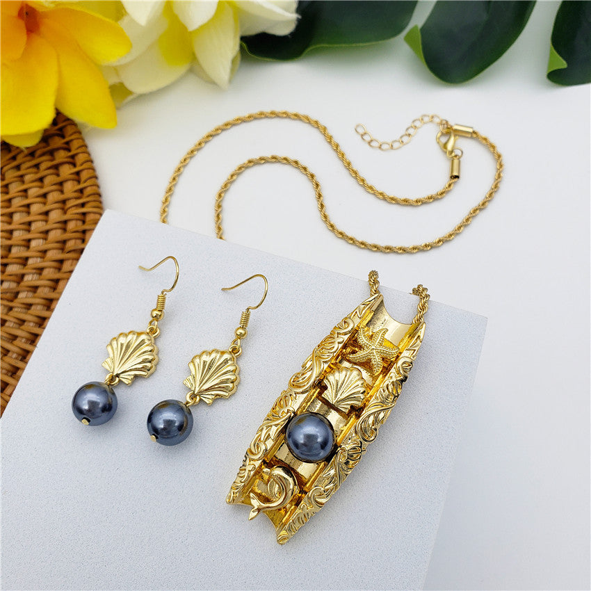 Set Of Seashell Earrings With Petrol Pearl And Carved Tunnel Necklace Of Starfish+Seashell+Dolphin Charms And A Petrol Pearl