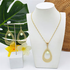 Set Of Carved Waves Double Teardrop Earrings And Necklace Sustained With A Pearl In Different Colors