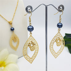 Set Of Carved Waves And Leaf Charm Earrings And Necklace Sustained With A Petrol Pearl And Different Hawaiian Charms