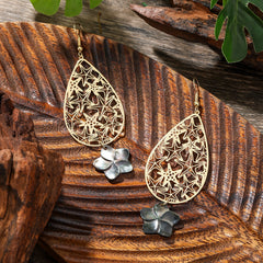 Carved Starfish Teardrop Earrings Sustained With A Black Lip Shell Plumeria Flower