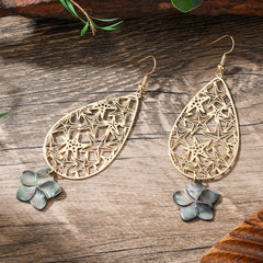 Carved Starfish Teardrop Earrings Sustained With A Black Lip Shell Plumeria Flower