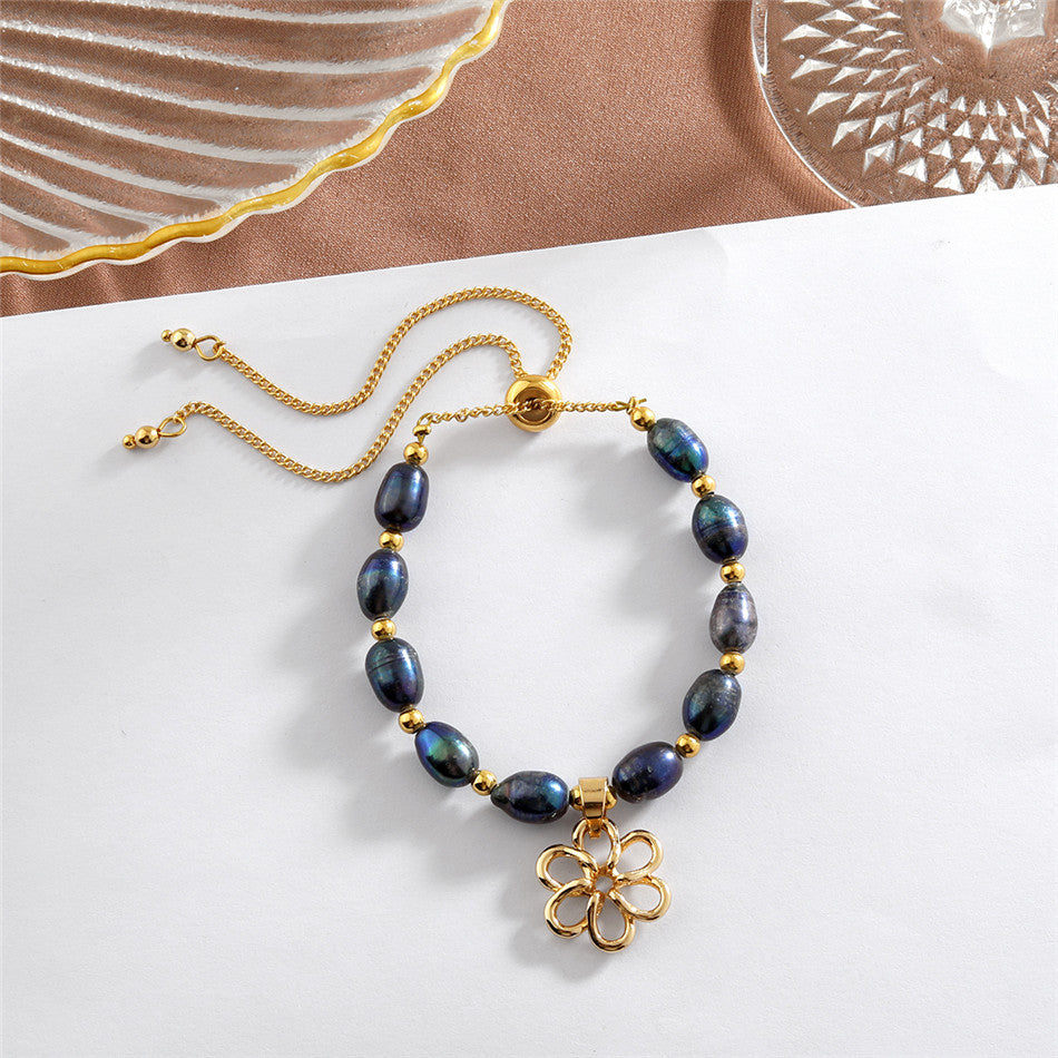 Tahitian Black Pearls Bracelet With Golden Beads In Hawaiian Charms