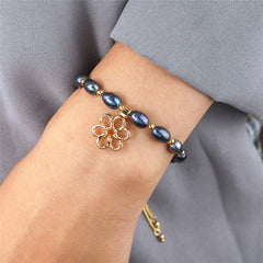 Tahitian Black Pearls Bracelet With Golden Beads In Hawaiian Charms