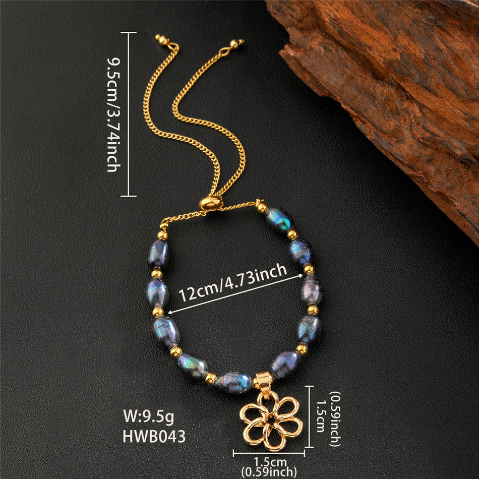 Tahitian Black Pearls Bracelet With Golden Beads In Hawaiian Charms