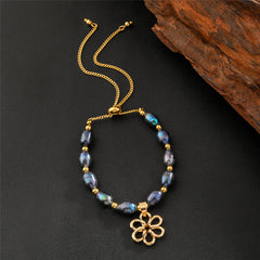 Tahitian Black Pearls Bracelet With Golden Beads In Hawaiian Charms