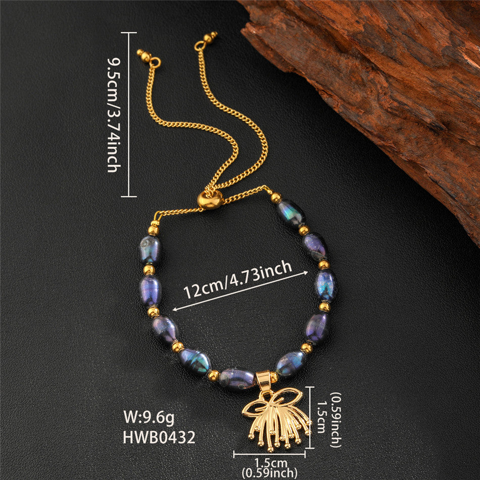 Tahitian Black Pearls Bracelet With Golden Beads In Hawaiian Charms