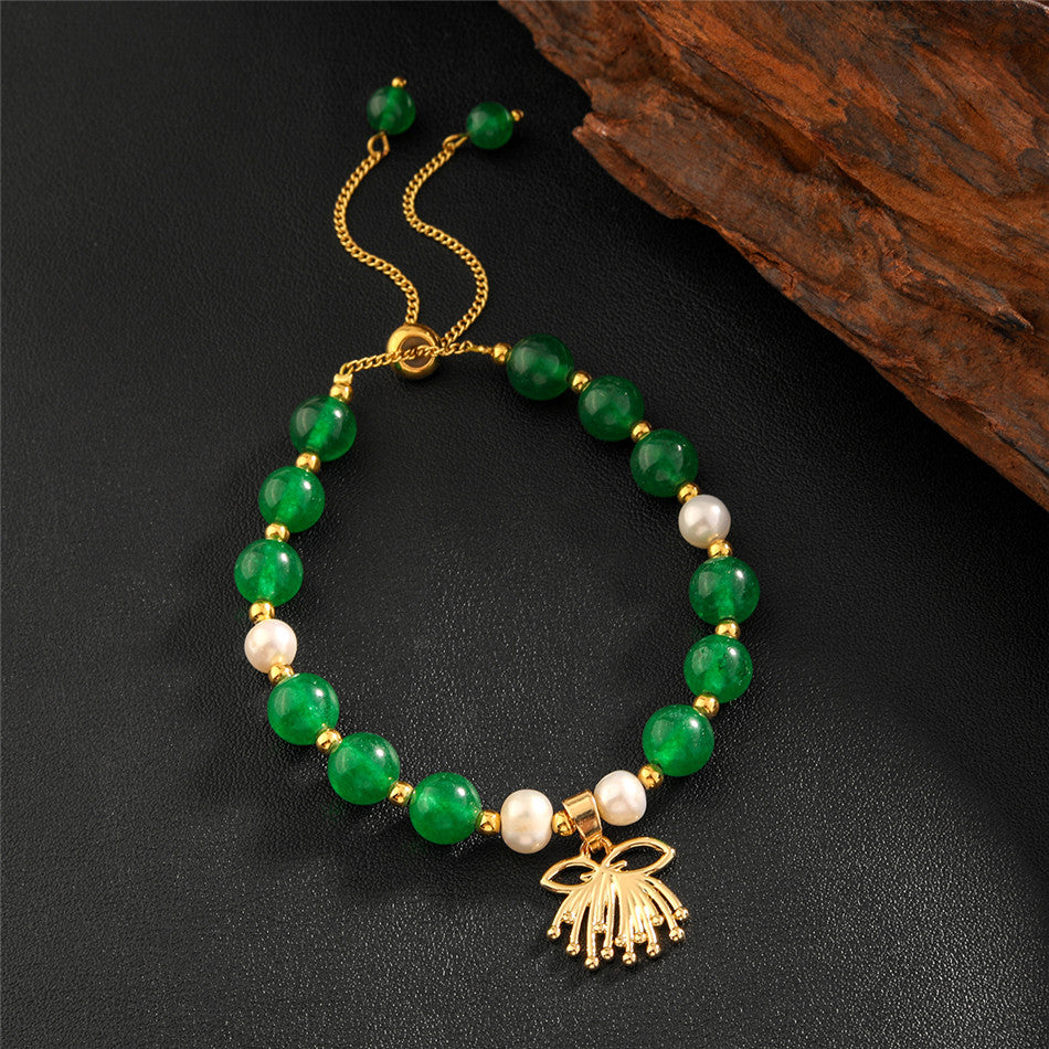 Pearls Bracelet With Golden Beads In Different Hawaiian Charms