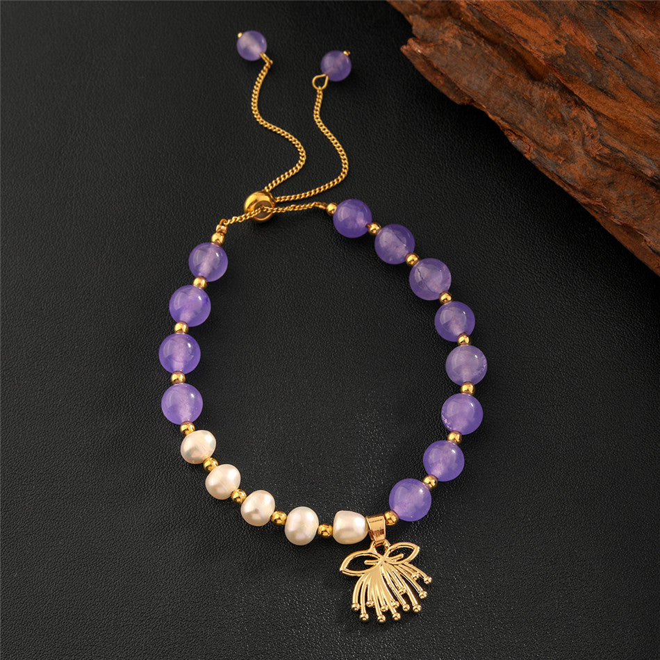 Pearls Bracelet With Golden Beads In Different Hawaiian Charms