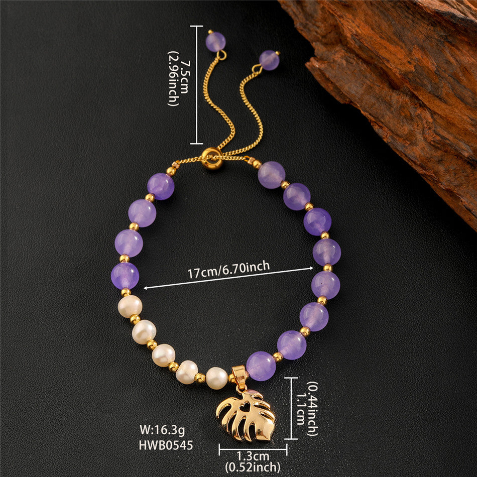 Pearls Bracelet With Golden Beads In Different Hawaiian Charms