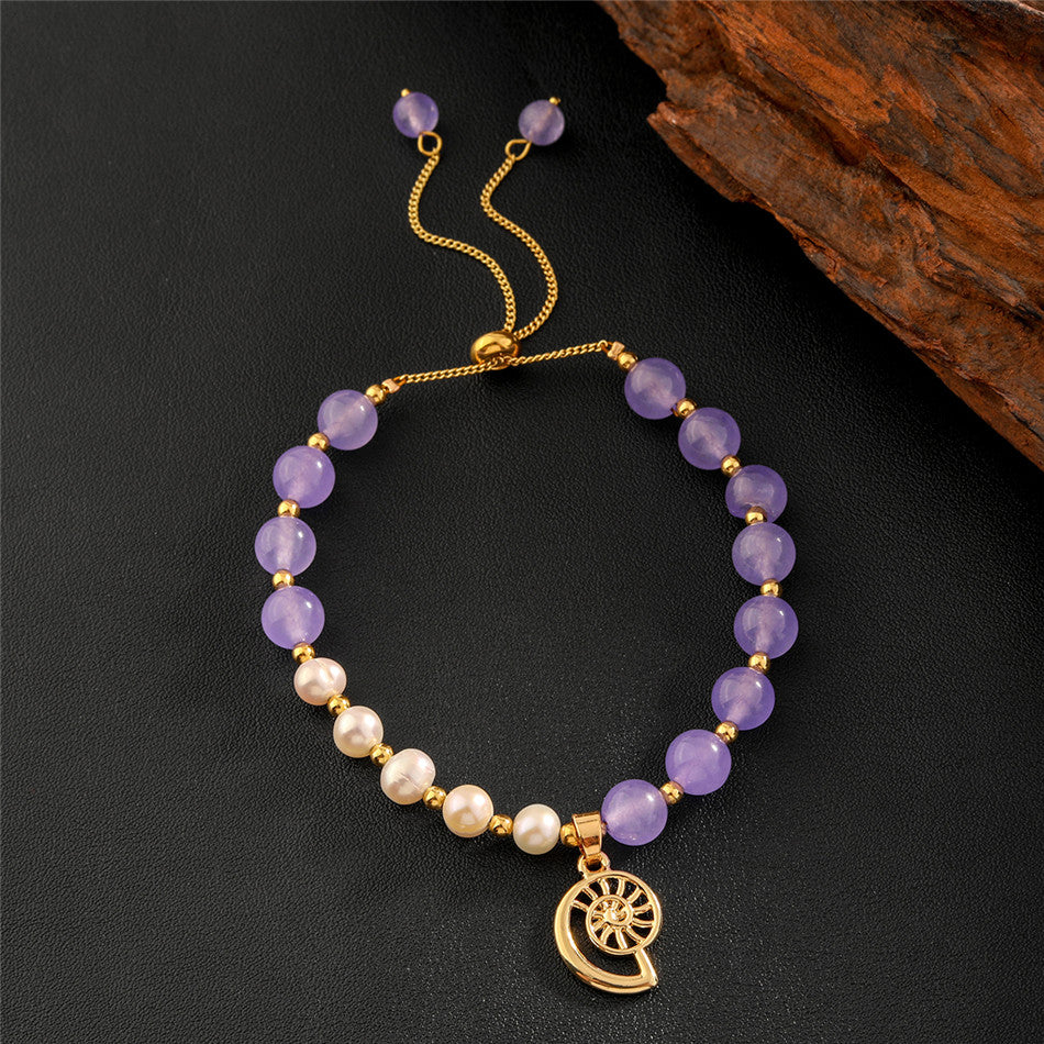 Pearls Bracelet With Golden Beads In Different Hawaiian Charms