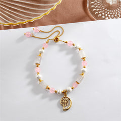 Pearl Bracelet With Light Pink Pearls And Golden Beads In Different Hawaiian Charms