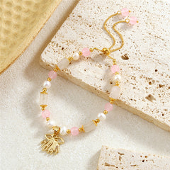 Pearl Bracelet With Light Pink Pearls And Golden Beads In Different Hawaiian Charms