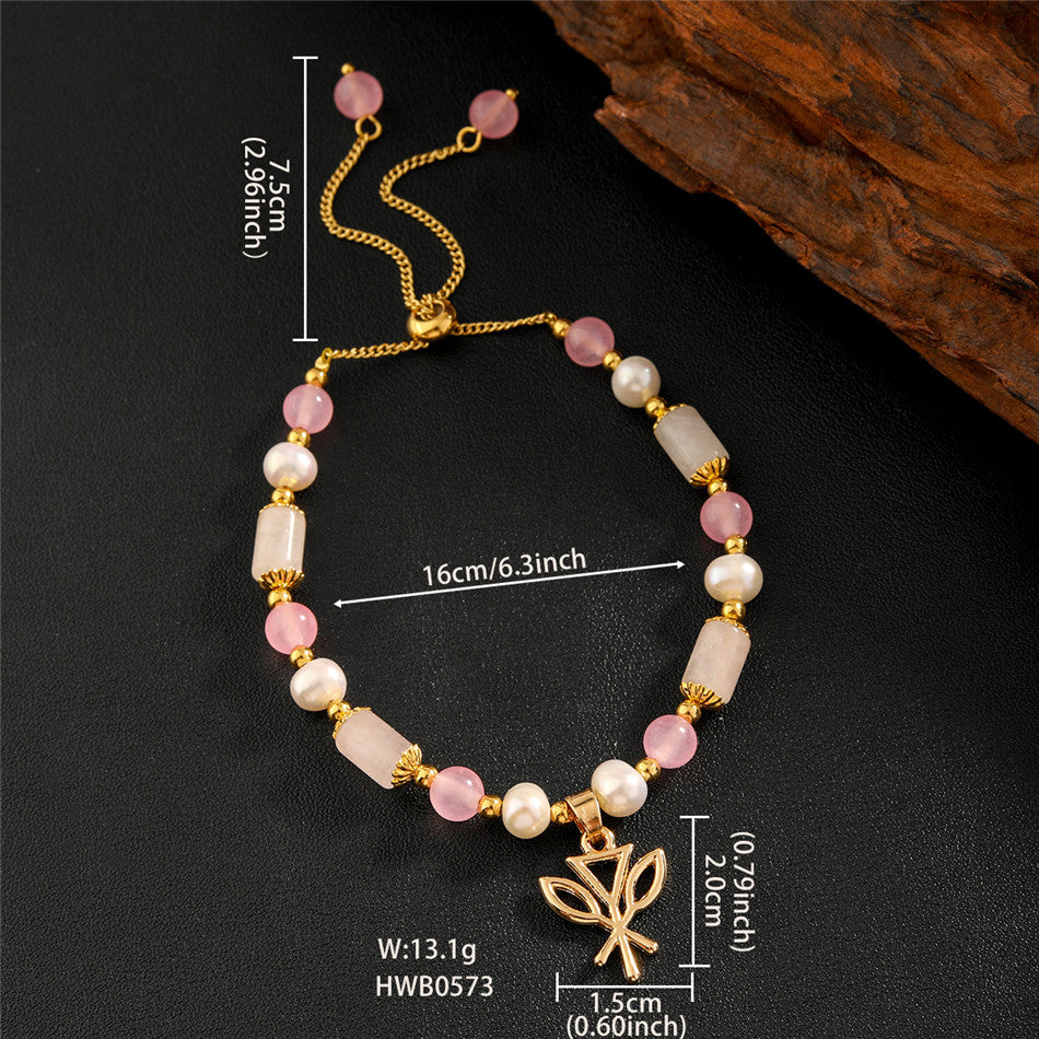 Pearl Bracelet With Light Pink Pearls And Golden Beads In Different Hawaiian Charms