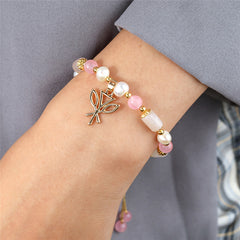 Pearl Bracelet With Light Pink Pearls And Golden Beads In Different Hawaiian Charms