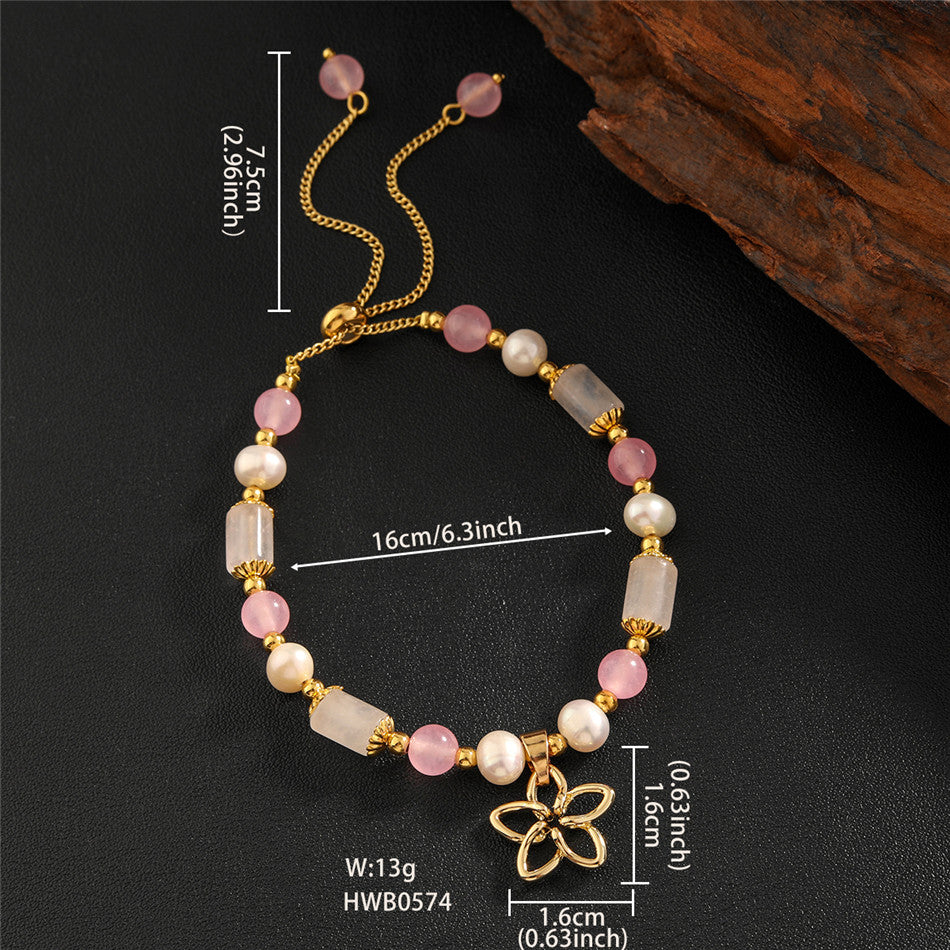 Pearl Bracelet With Light Pink Pearls And Golden Beads In Different Hawaiian Charms