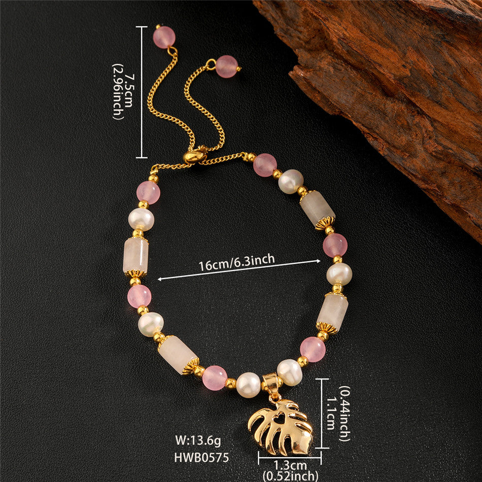 Pearl Bracelet With Light Pink Pearls And Golden Beads In Different Hawaiian Charms