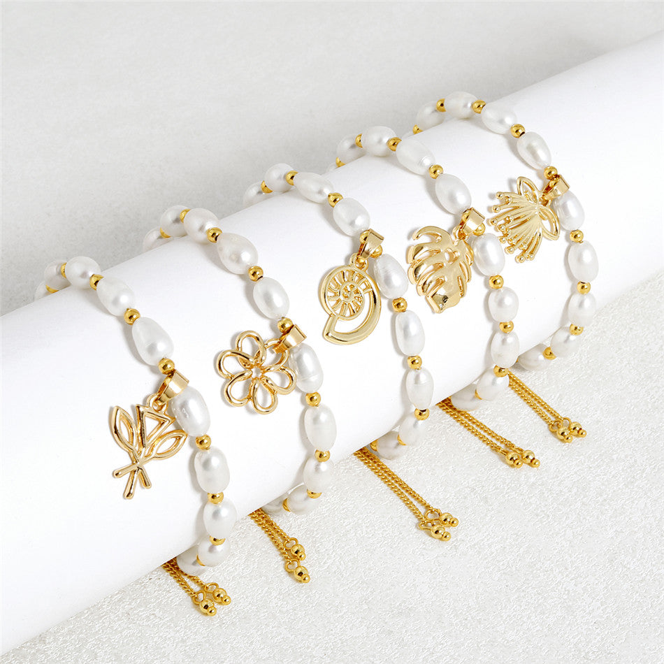 White Oval Pearls And Golden Beads Bracelet In Different Hawaiian Charms