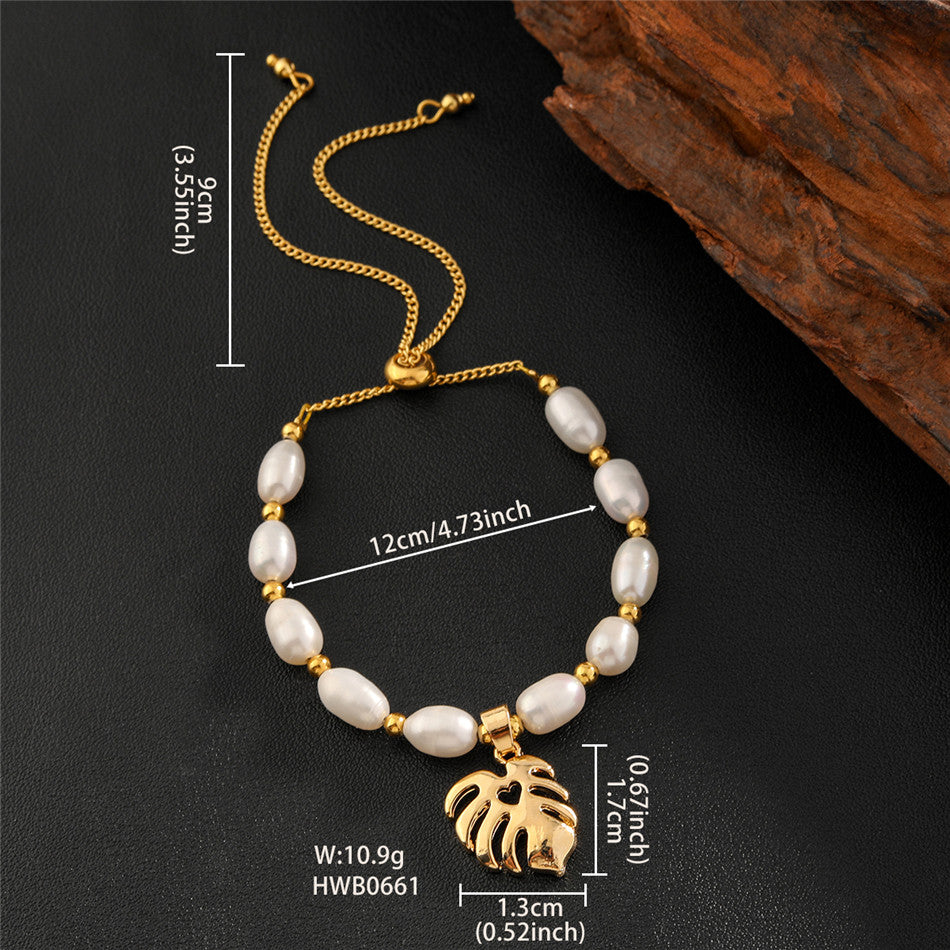 White Oval Pearls And Golden Beads Bracelet In Different Hawaiian Charms