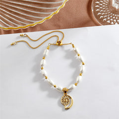 White Oval Pearls And Golden Beads Bracelet In Different Hawaiian Charms