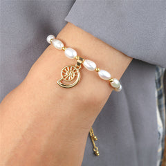 White Oval Pearls And Golden Beads Bracelet In Different Hawaiian Charms