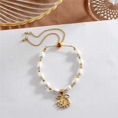 White Oval Pearls And Golden Beads Bracelet In Different Hawaiian Charms