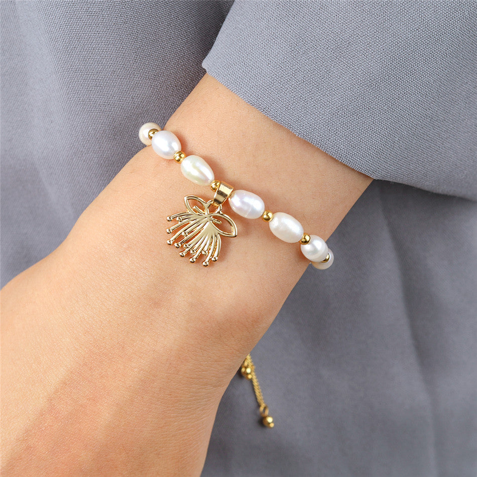 White Oval Pearls And Golden Beads Bracelet In Different Hawaiian Charms