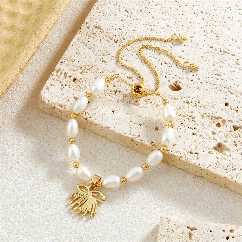 White Oval Pearls And Golden Beads Bracelet In Different Hawaiian Charms