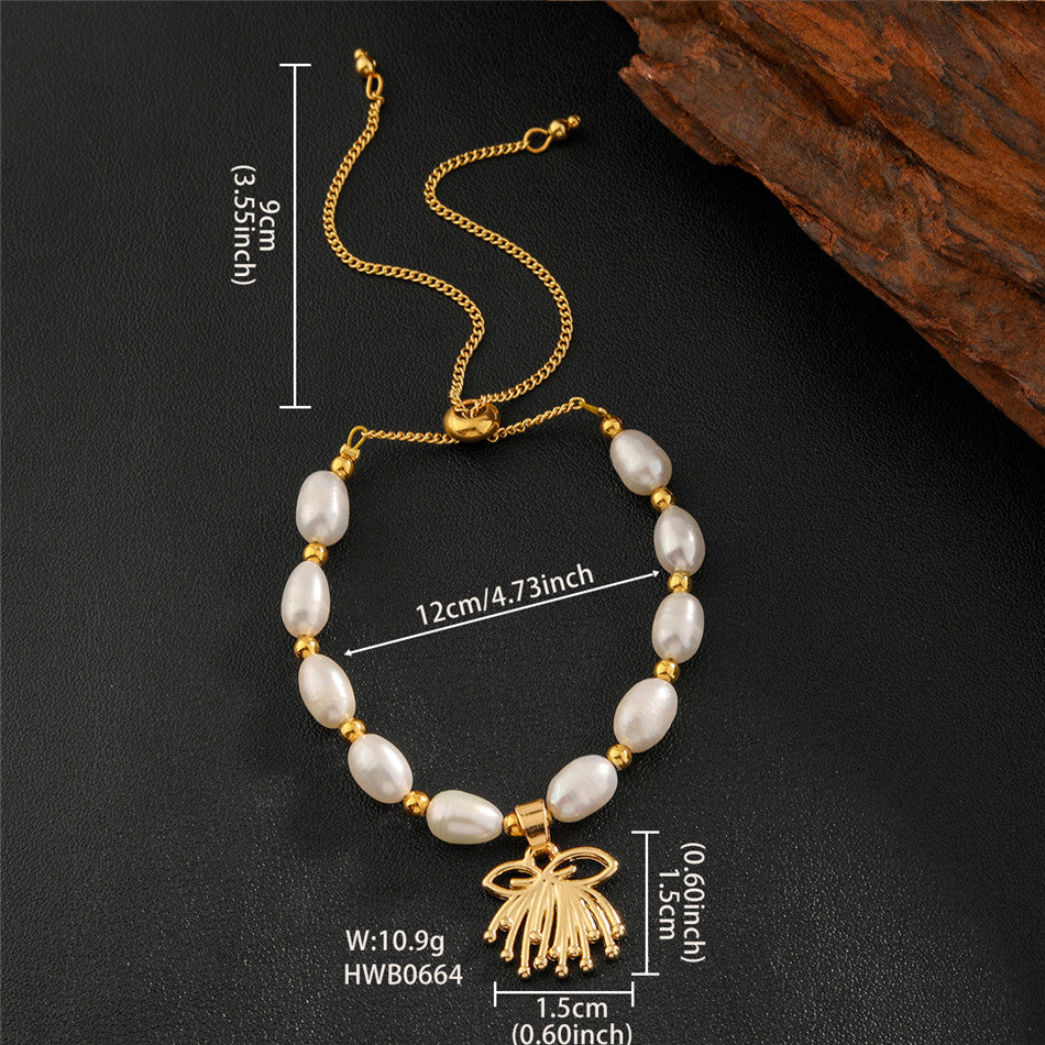 White Oval Pearls And Golden Beads Bracelet In Different Hawaiian Charms