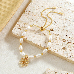 White Oval Pearls And Golden Beads Bracelet In Different Hawaiian Charms