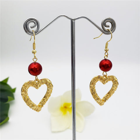 Carved Heart Earrings Sustained With A Pearl In Different Colors