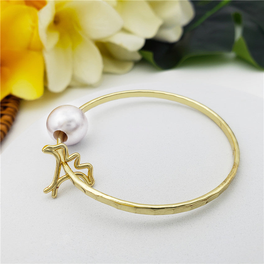 Bracelet With A Pearl & Charm In Different Styles And Colors