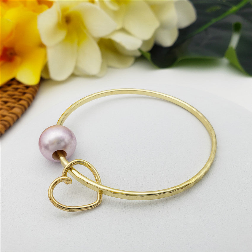 Bracelet With A Pearl & Charm In Different Styles And Colors