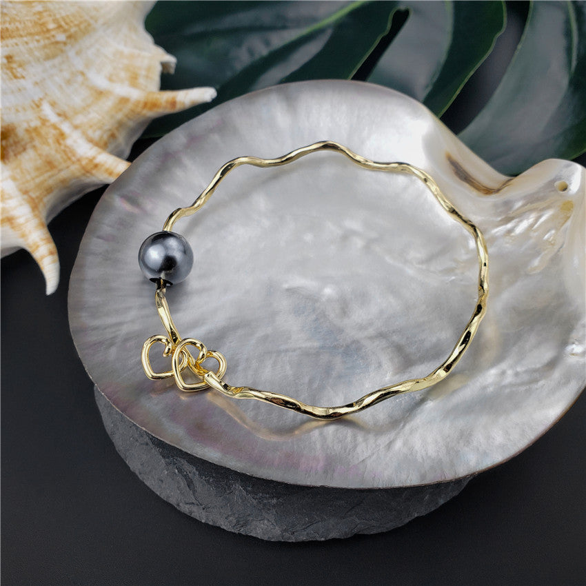 Wavy Bracelet With A Pearl & Charm In Different Styles And Colors