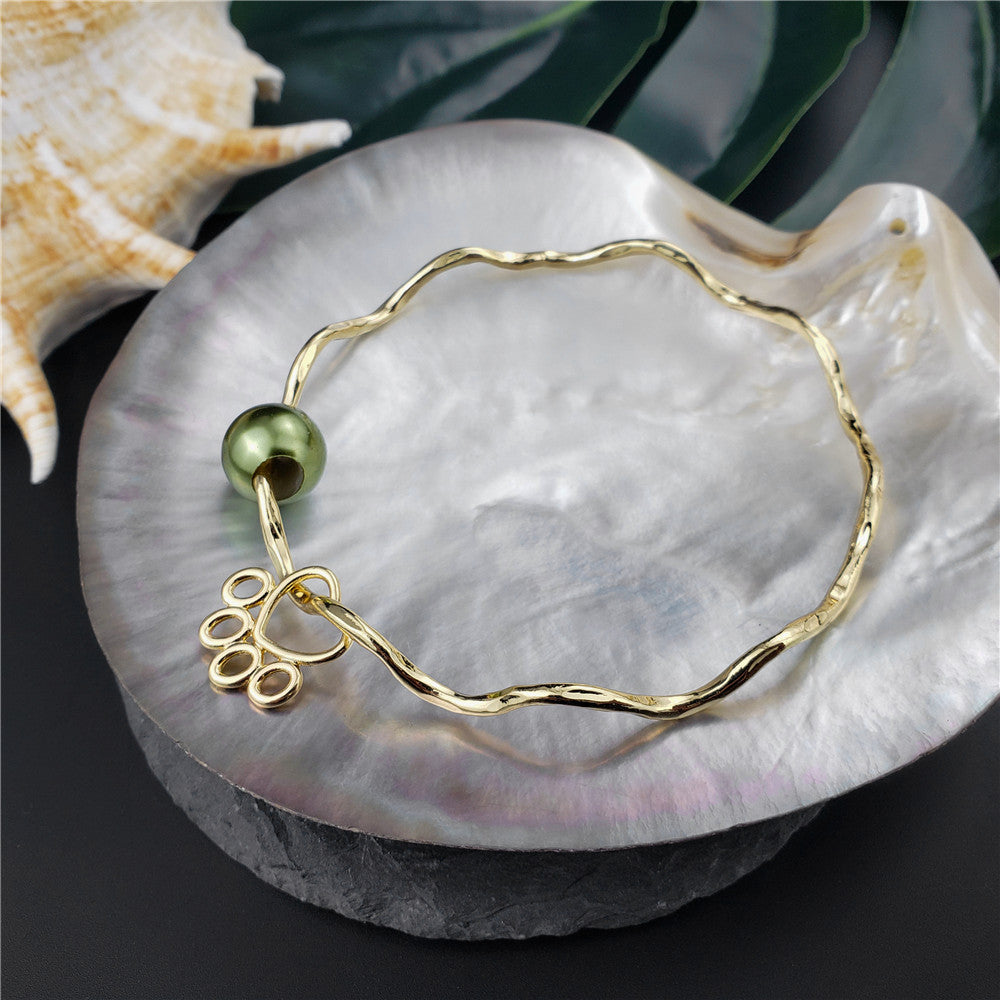 Wavy Bracelet With A Pearl & Charm In Different Styles And Colors