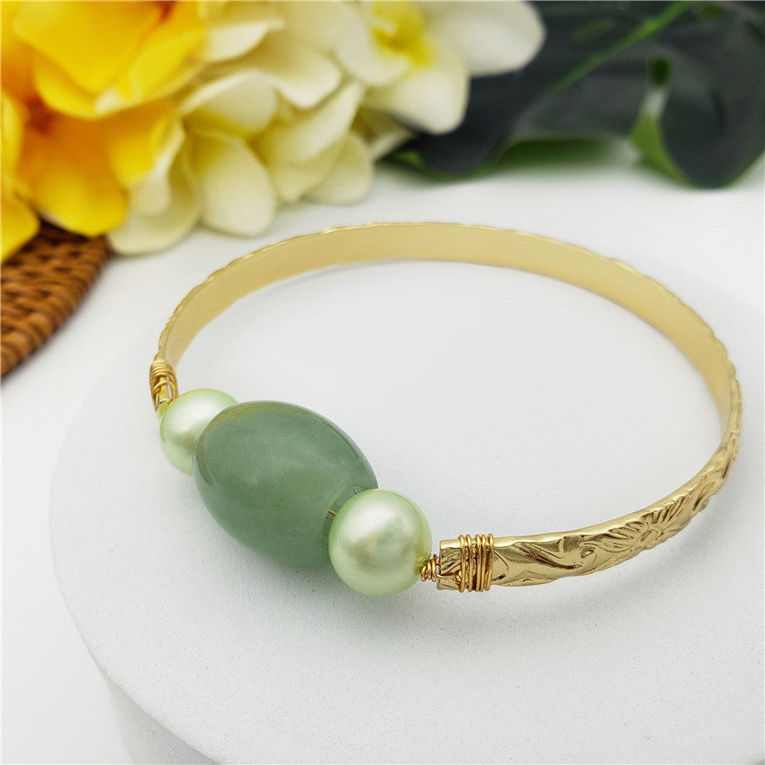 Carved Bracelet With A Green Jade Stone And Light Green Pearls