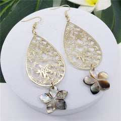 Carved Starfish Teardrop Earrings Sustained With A Black Lip Shell Plumeria Flower