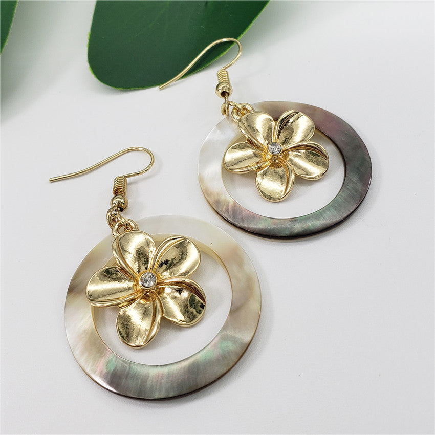 Black Shell Round Earrings With Plumeria Flower Charm Centered With A White Zircon