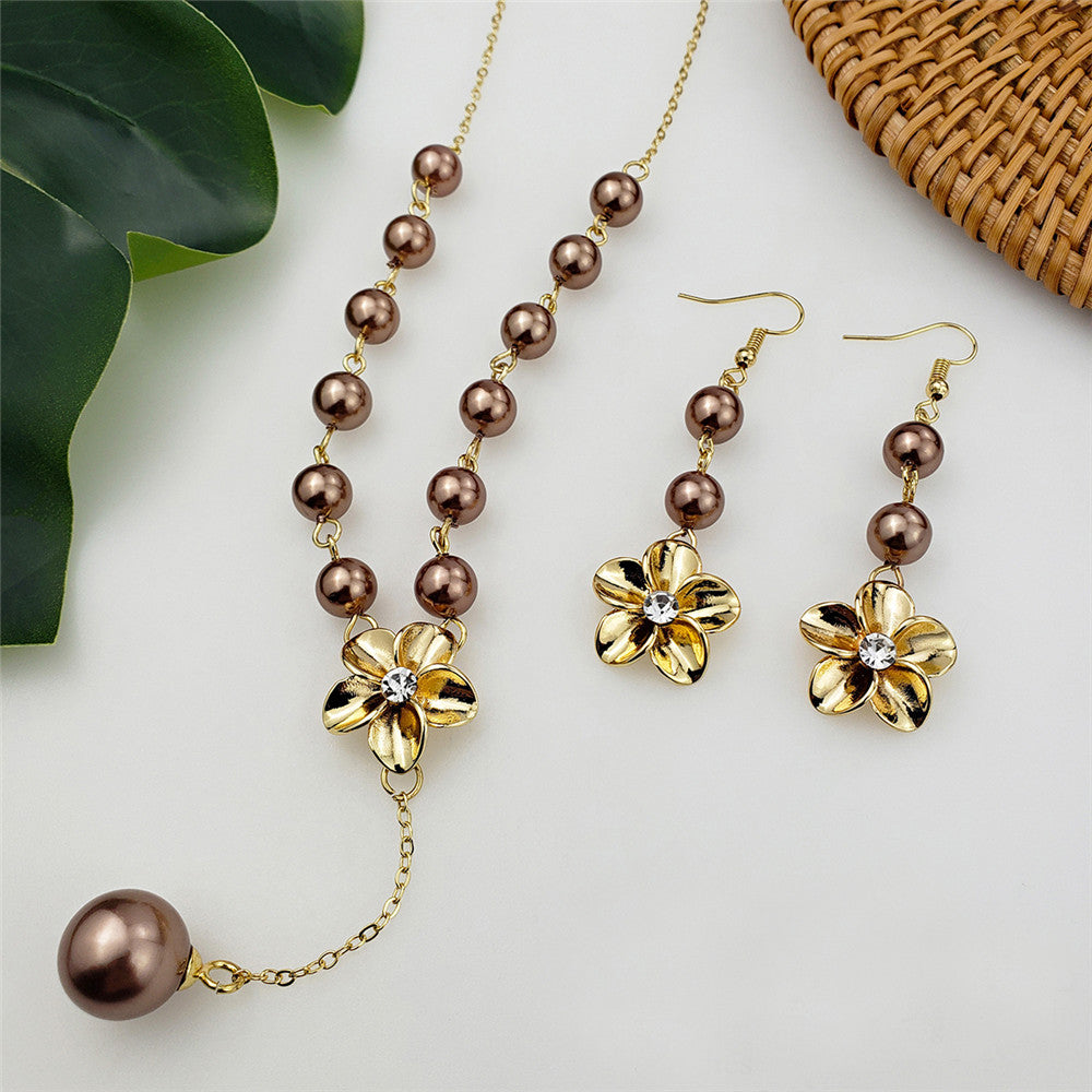 Set Of Earrings And Necklace Hibiscus Flower Centered With White Zircon And Chocolate Tahitian Pearls