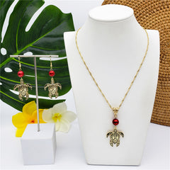 Set Of Hawaiian Carved Sea Turtle Earrings And Necklace Sustained With A Pearl In 2 Different Colors