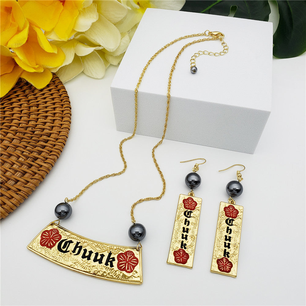 Set Of Engraved "Chuuk" In Between Hibiscus Flowers Bar Earrings And Necklace With A Petrol Pearl