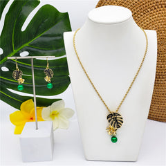 Set Of Hawaiian Monstera Leaf And Plumeria Flower Earrings And Necklace Sustained With A Pearl In 2 Different Colors