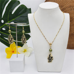 Set Of Hawaiian Carved Hibiscus Flower And Leaves Earrings And Necklace Sustained With A Pearl In Different Colors