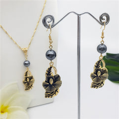 Set Of Hawaiian Carved Hibiscus Flower And Leaves Earrings And Necklace Sustained With A Pearl In Different Colors